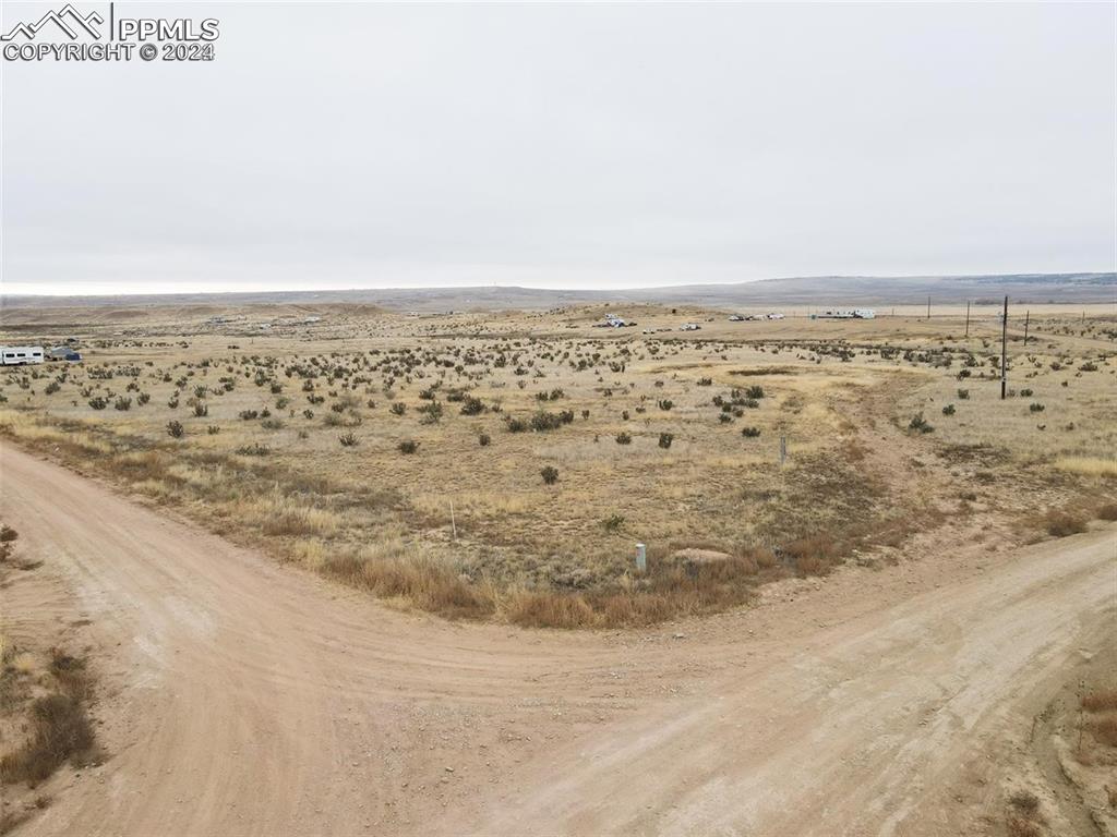 Image 3 of 25: Birds eye view of property with a rural view