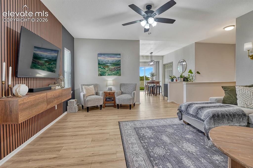 Image 15 of 50: Fabulous accent wall with wood elements and floating console.