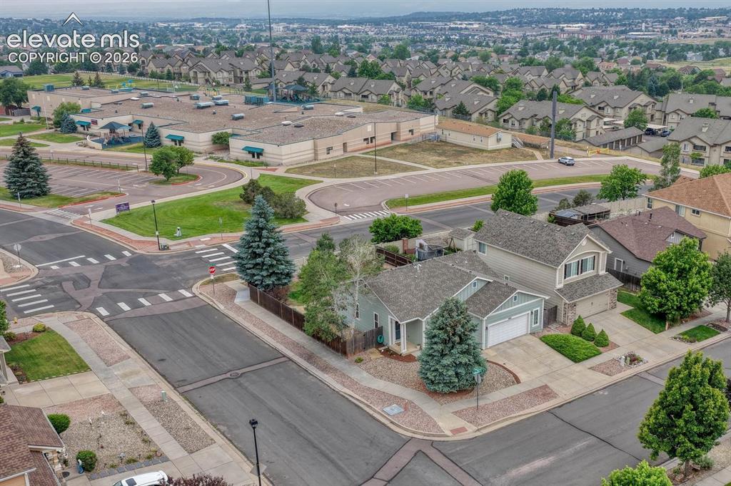 Image 2 of 50: Aerial view of home located on a corner lot that backs to the local element