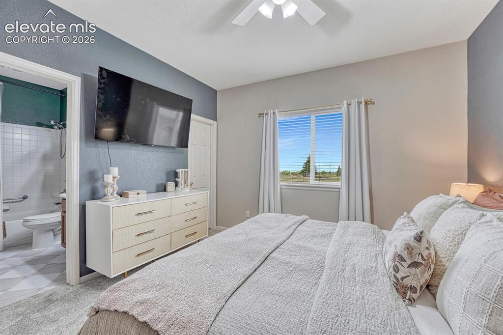 Image 31 of 50: The primary suite provides a peaceful retreat with designer finishes, a fea