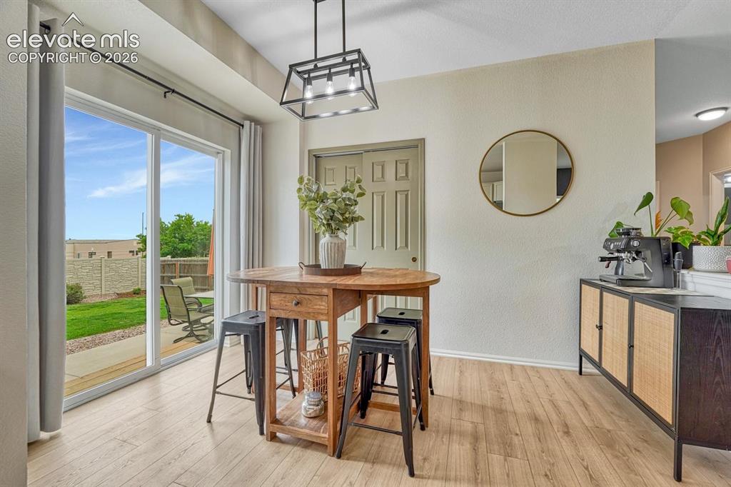 Image 4 of 50: The dining area incl a pantry & walk-out access to a large backyard patio.