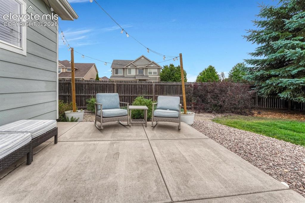 Image 41 of 50: Relax on the expansive back patio and enjoy the beautiful Colorado weather.