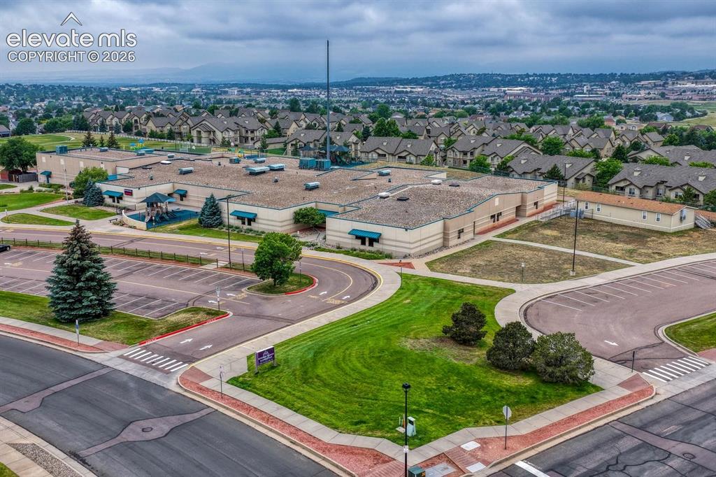 Image 46 of 50: Aerial view of Springs Ranch Elementary School behind the home.