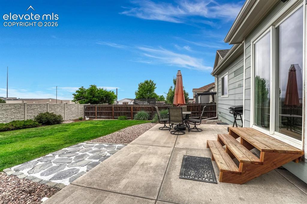 Image 5 of 50: Expansive backyard patio, ideal for outdoor dining and entertaining.