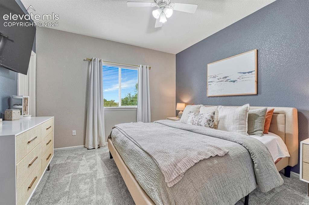 Image 7 of 50: The primary suite provides a peaceful retreat with designer finishes, a fea