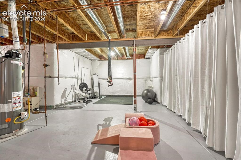 Image 8 of 50: The unfinished basement is ready for expansion & your own finishing touche