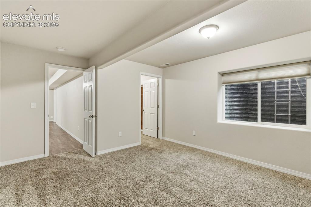 Image 31 of 48: Bedroom 3 has a walk in closet with access to cold storage/safe room