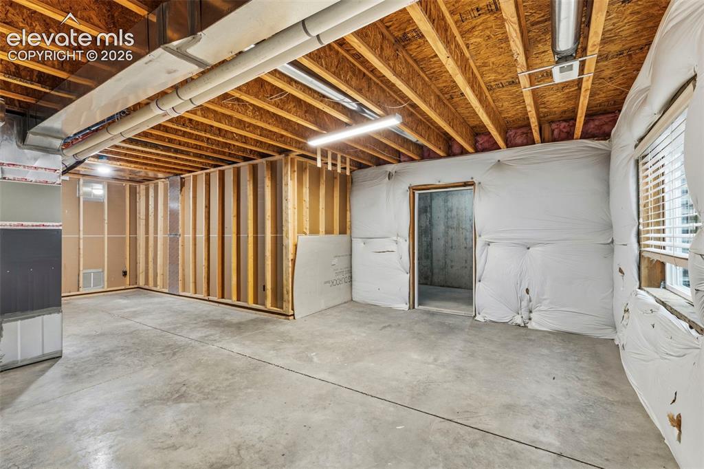 Image 36 of 48: Unfinished space has access to 2nd cold storage