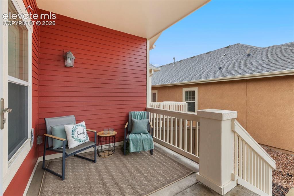 Image 9 of 48: Cozy covered porch