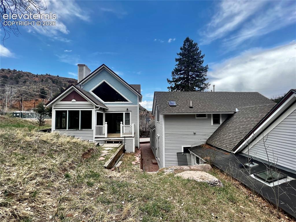 Image 2 of 20: Rear view of the 3 Hydro Custom cottage on the left and the Main Victorian 