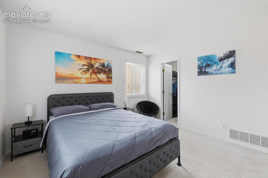 Image 15 of 39: Primary bedroom with large walk-in closet.