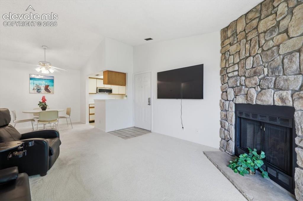 Image 2 of 39: Very open with a beautiful wood burning fireplace.