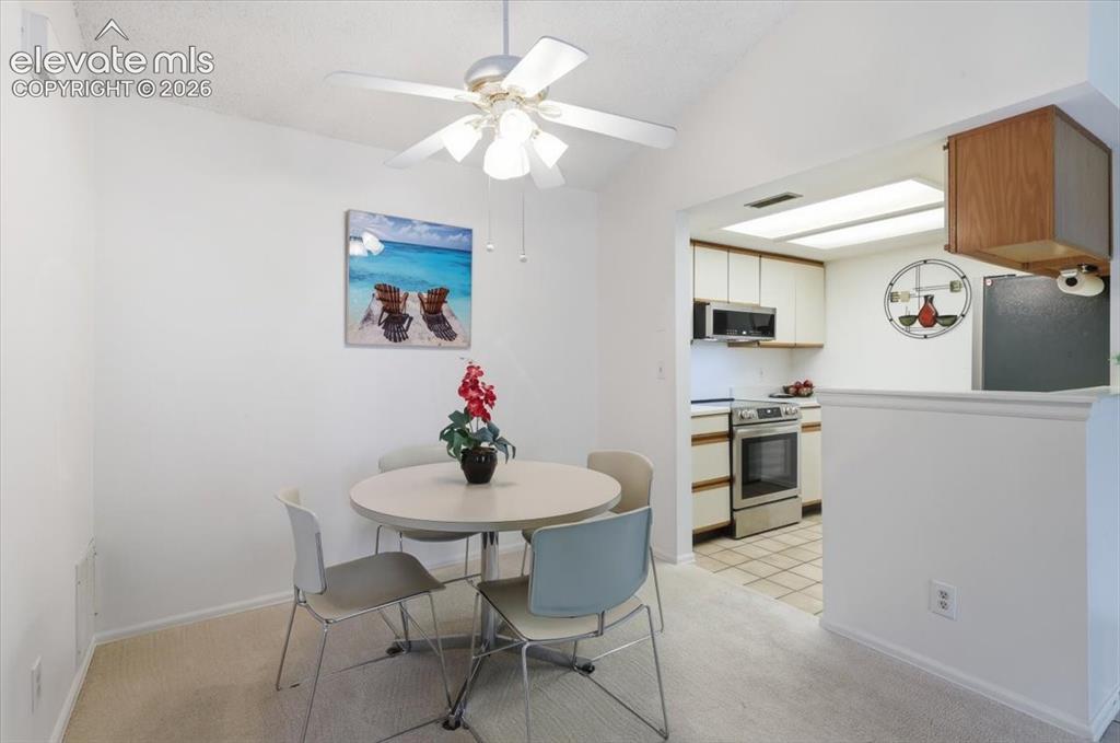 Image 3 of 39: Dining area and kitchen.