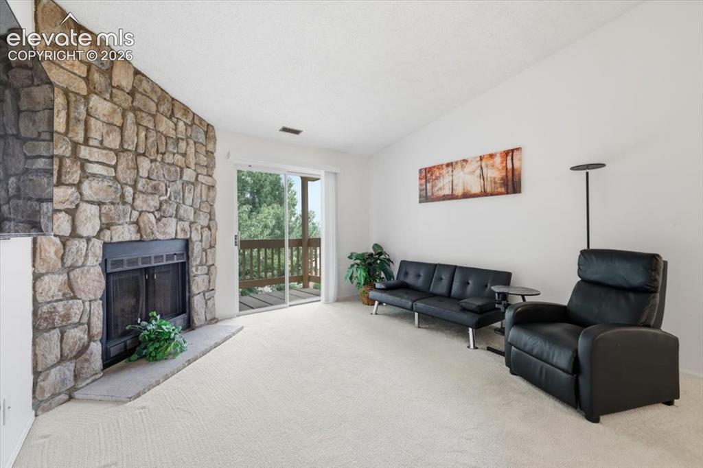 Image 7 of 39: Living room with walk-out to the balcony.
