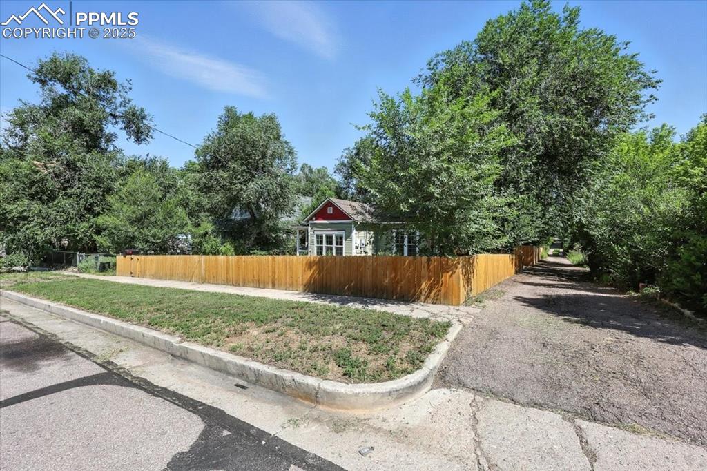 Image 4 of 36: View of property exterior with asphalt driveway