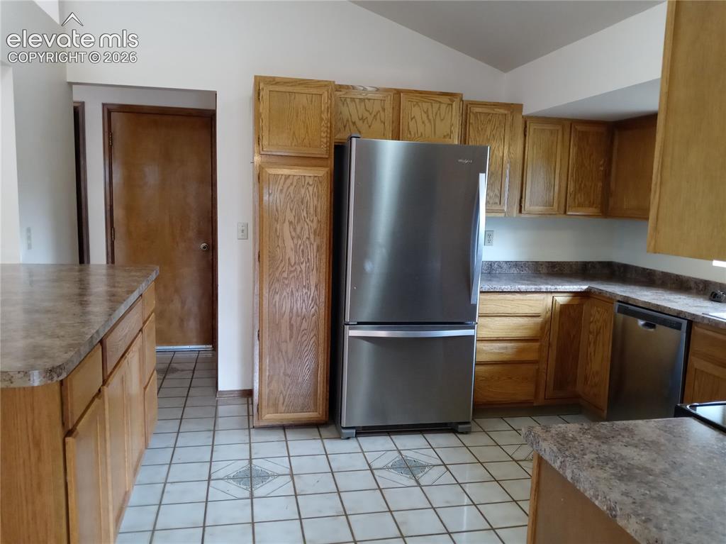 Image 2 of 35: Kitchen featuring light wood cabinetry and countertops