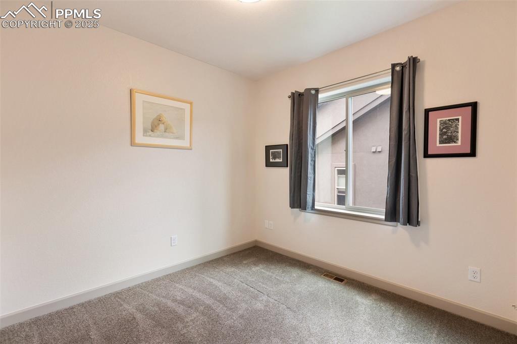 Image 29 of 38: Bedroom