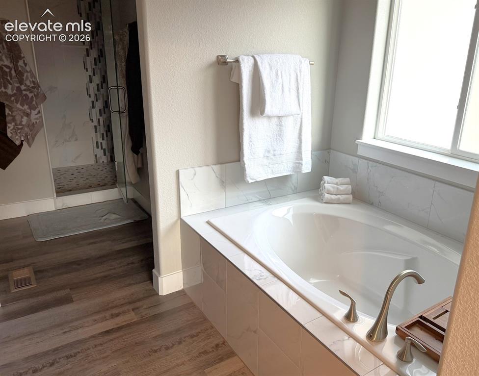 Image 19 of 47: Primary Bathroom with soaking tub