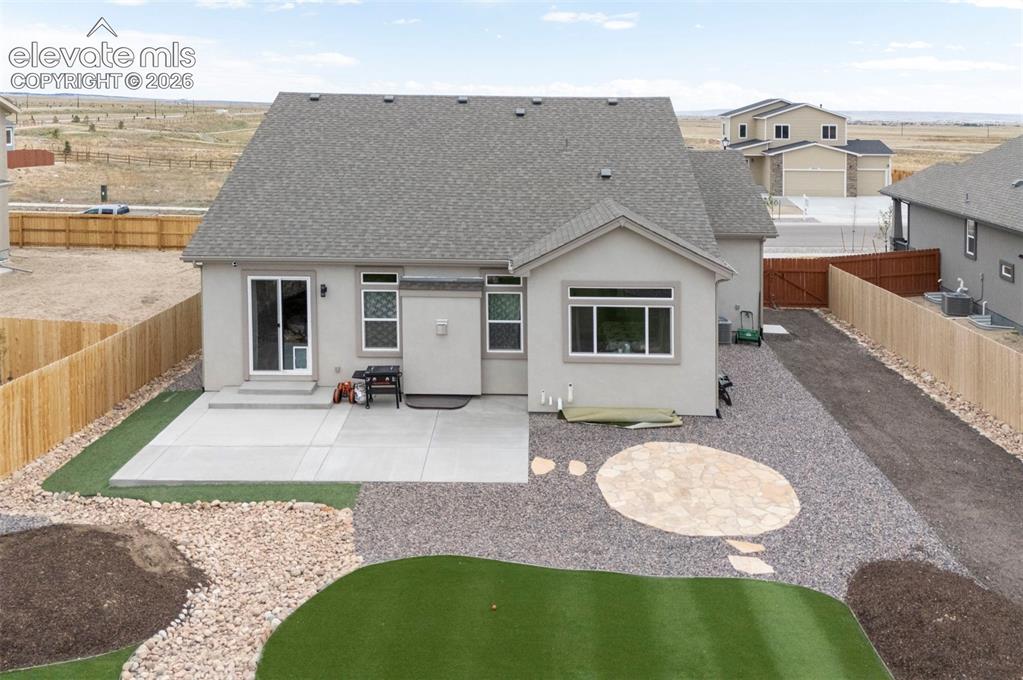 Image 46 of 47: View of yard with side area for additional parking