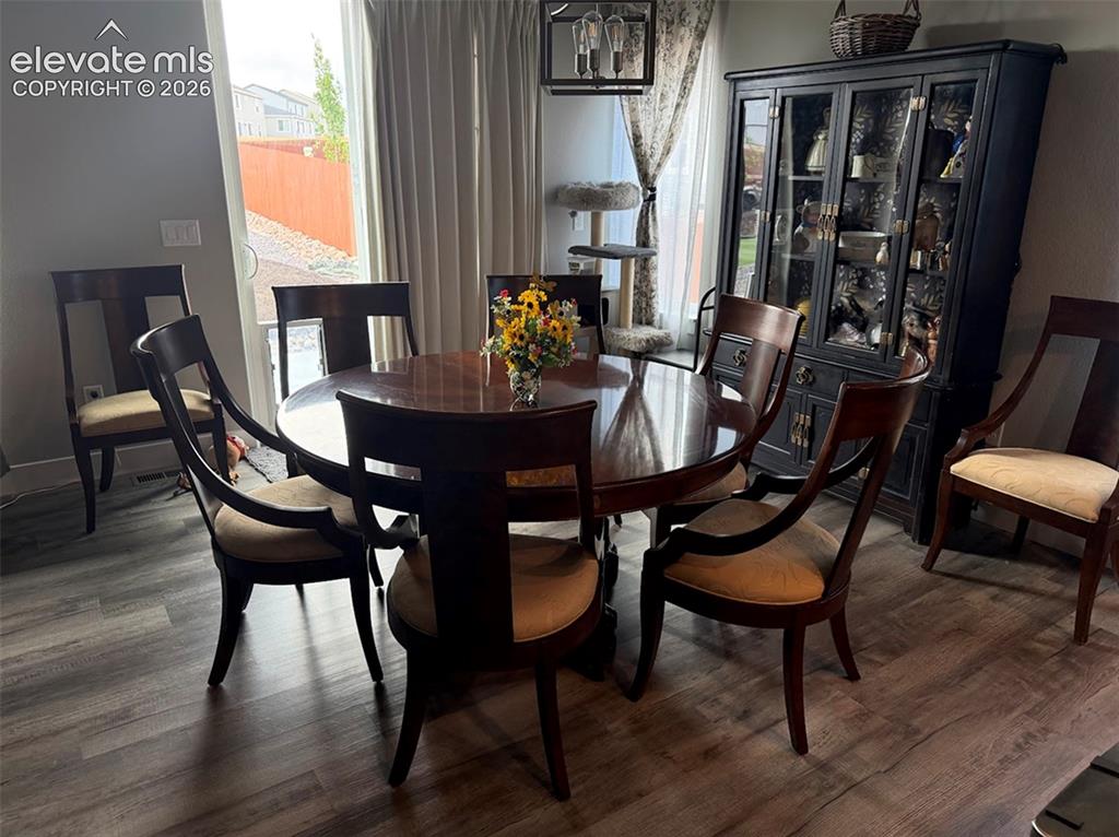 Image 7 of 47: Dining Area with walkout to the backyard.