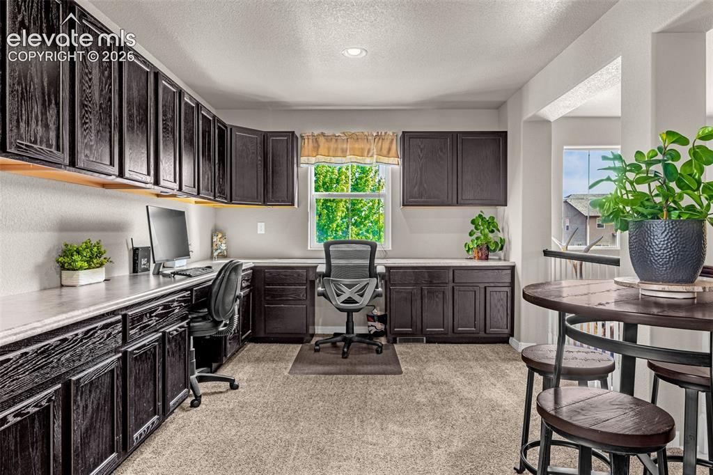 Image 17 of 42: upstairs Loft with built in office