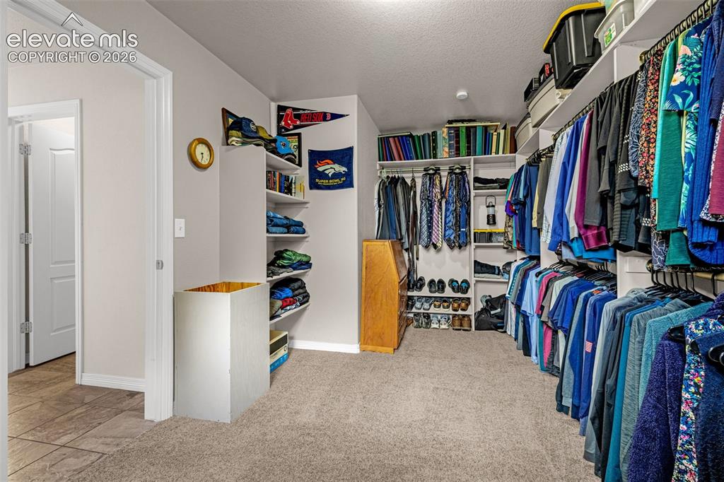Image 22 of 42: Primary walk in closet