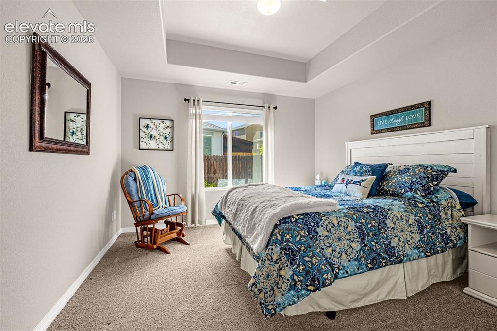 Image 32 of 42: main level bedroom