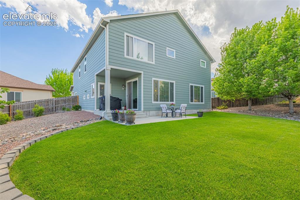 Image 35 of 42: beautifully landscaped back yard