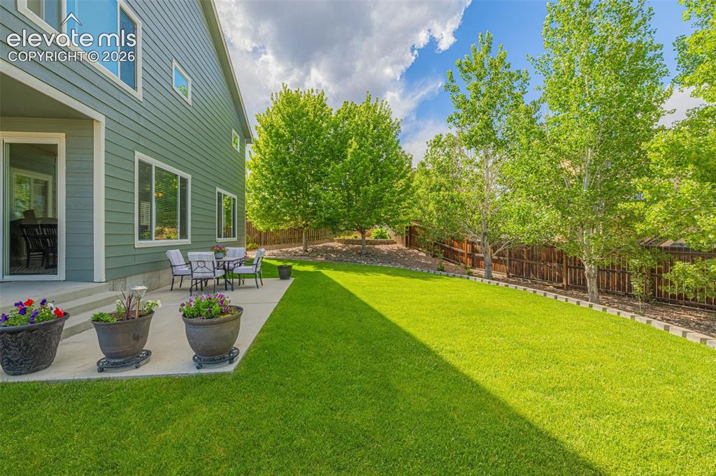 Image 37 of 42: beautifully landscaped back yard