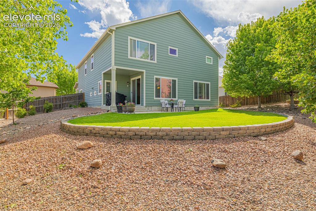 Image 39 of 42: beautifully landscaped back yard