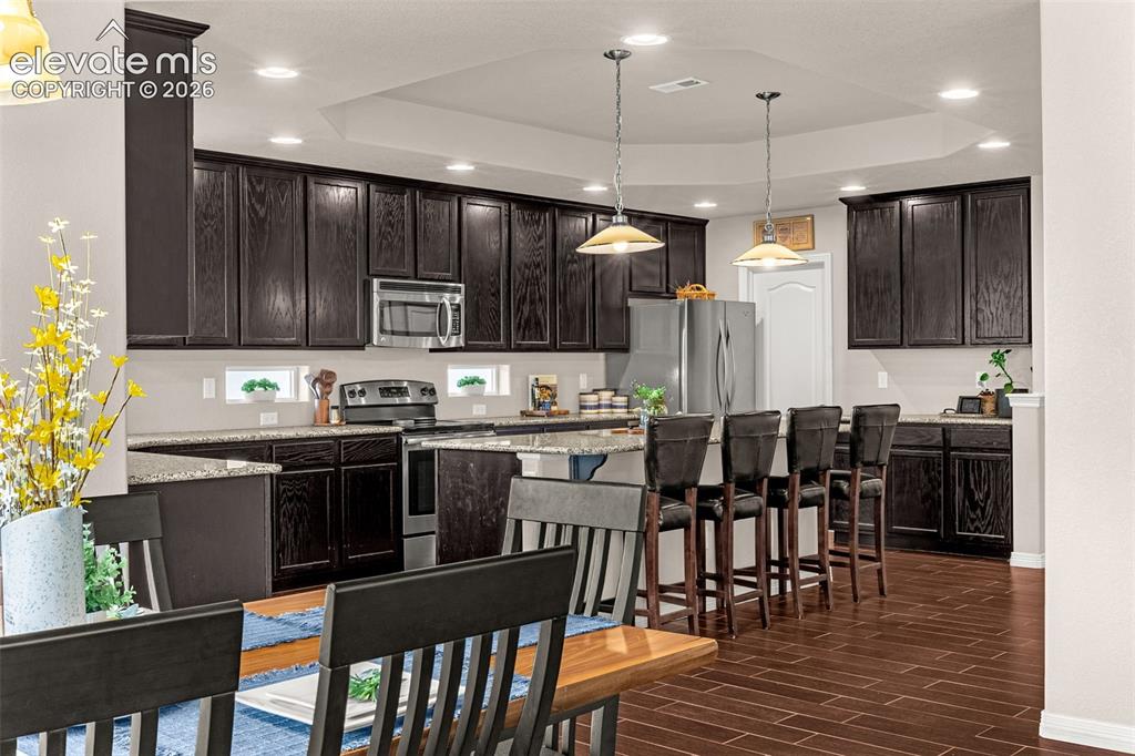 Image 8 of 42: Kitchen with breakfast bar
