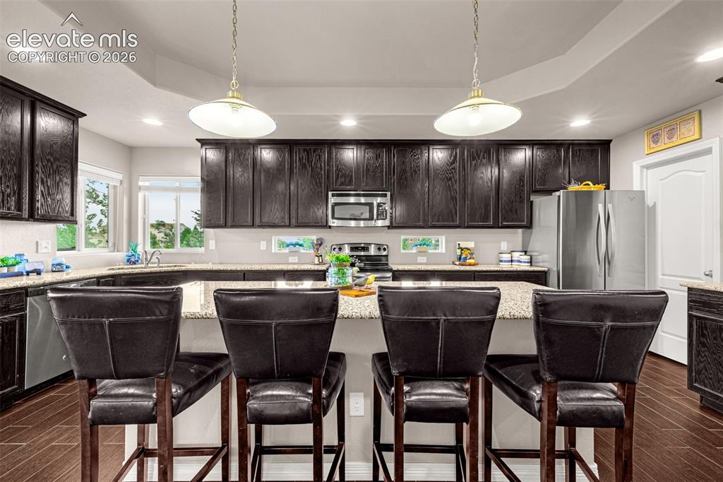 Image 9 of 42: Kitchen with breakfast bar