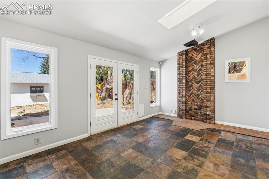 Image 20 of 50: Herringbone brick architectural feature with an integrated hearth