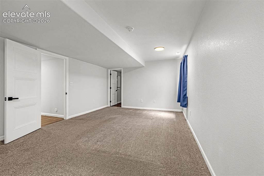 Image 24 of 49: 2nd master in basement with room for a cozy retreat area