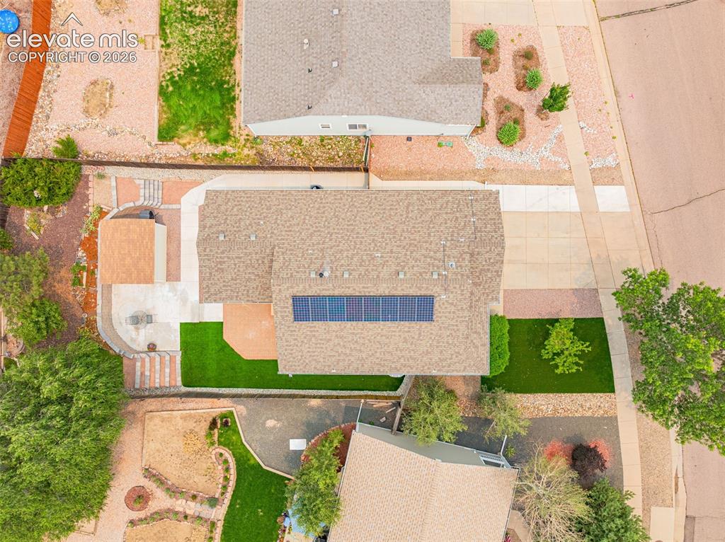 Image 39 of 49: Residential community featuring established homes with attached garages, ma