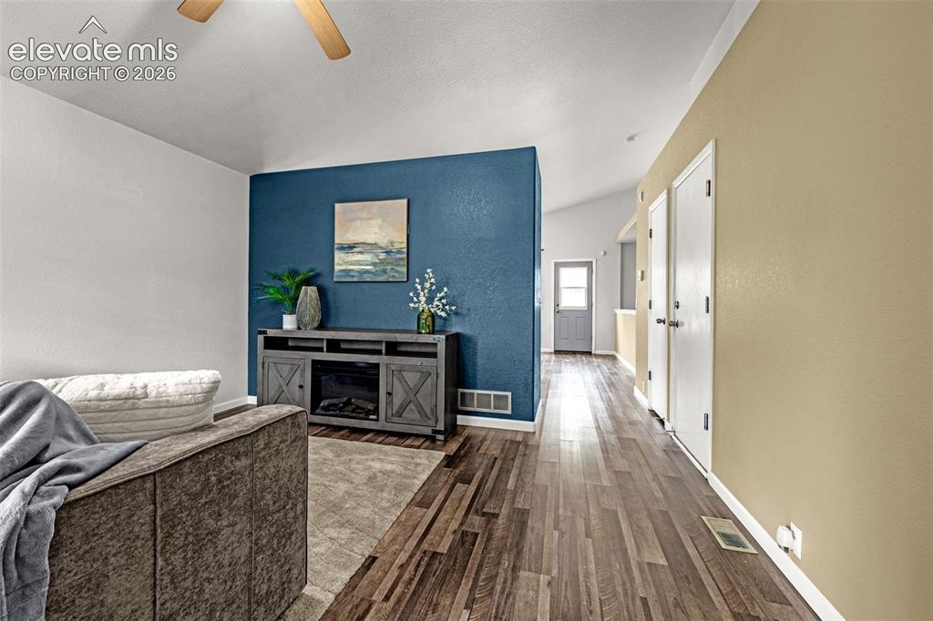 Image 5 of 49: Front entry with large windows that allow natural light