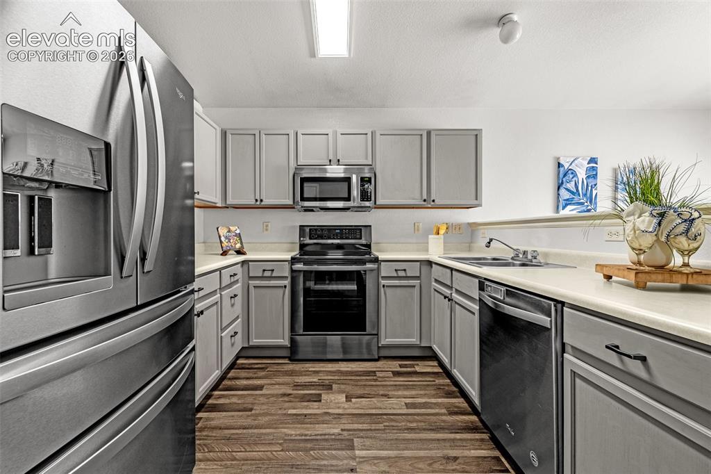 Image 6 of 49: Vaulted ceilings in living room and kitchen