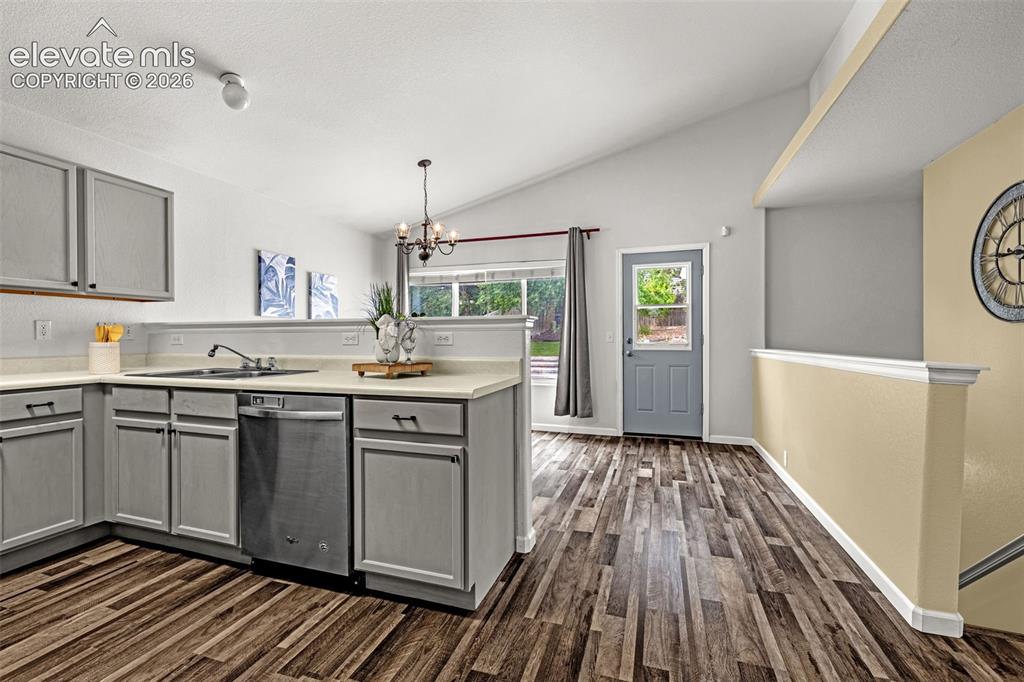 Image 7 of 49: Modern kitchen featuring stainless steel appliances, light gray cabinetry w