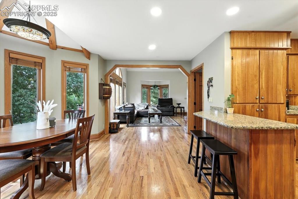 Image 10 of 36: Dining space featuring plenty of natural light, light wood-type flooring, a
