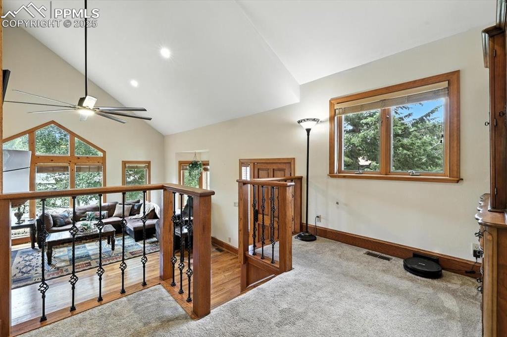 Image 12 of 36: Staircase with healthy amount of natural light, ceiling fan, recessed light