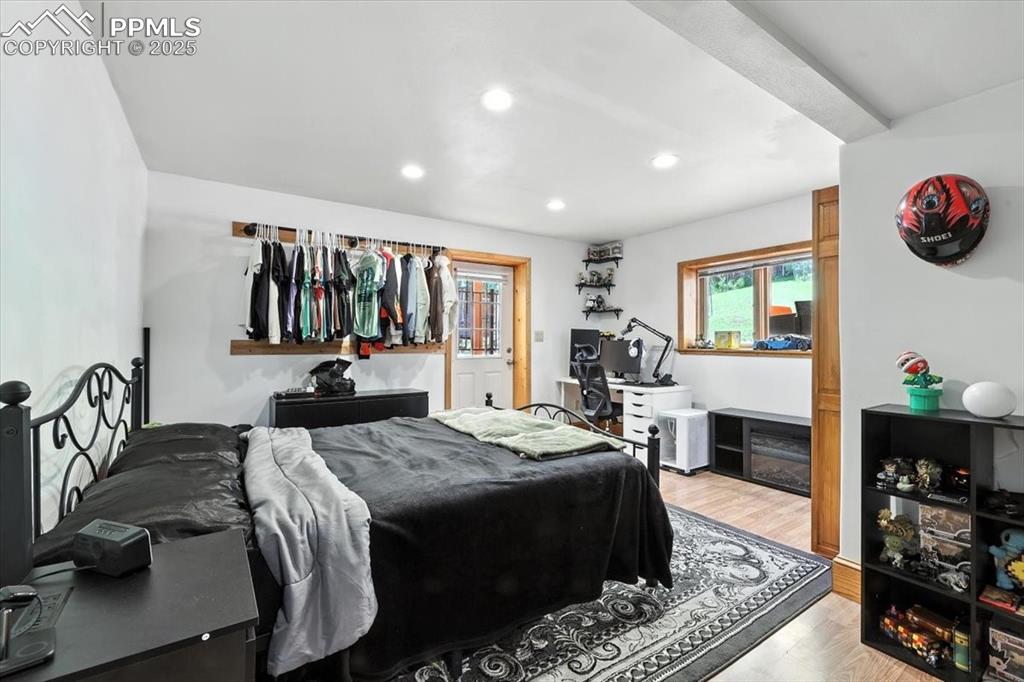 Image 24 of 36: Bedroom featuring recessed lighting and wood finished floors