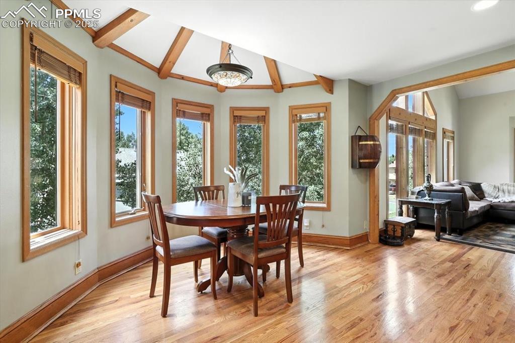 Image 7 of 36: Dining area featuring light wood-style flooring