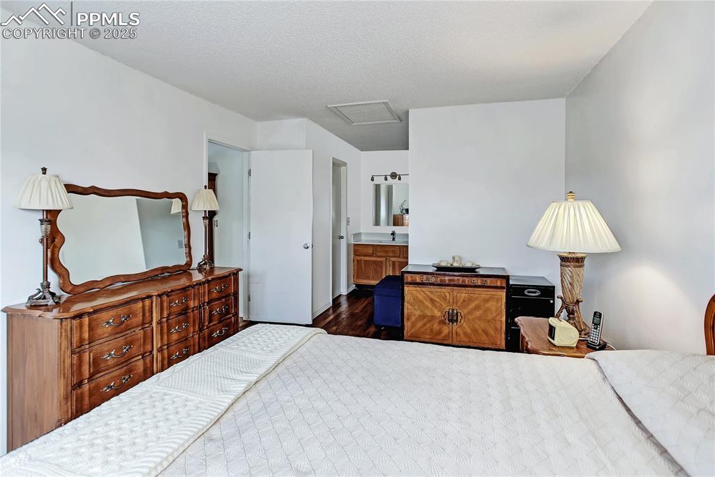 Image 15 of 25: Bedroom 2 w/ private vanity
