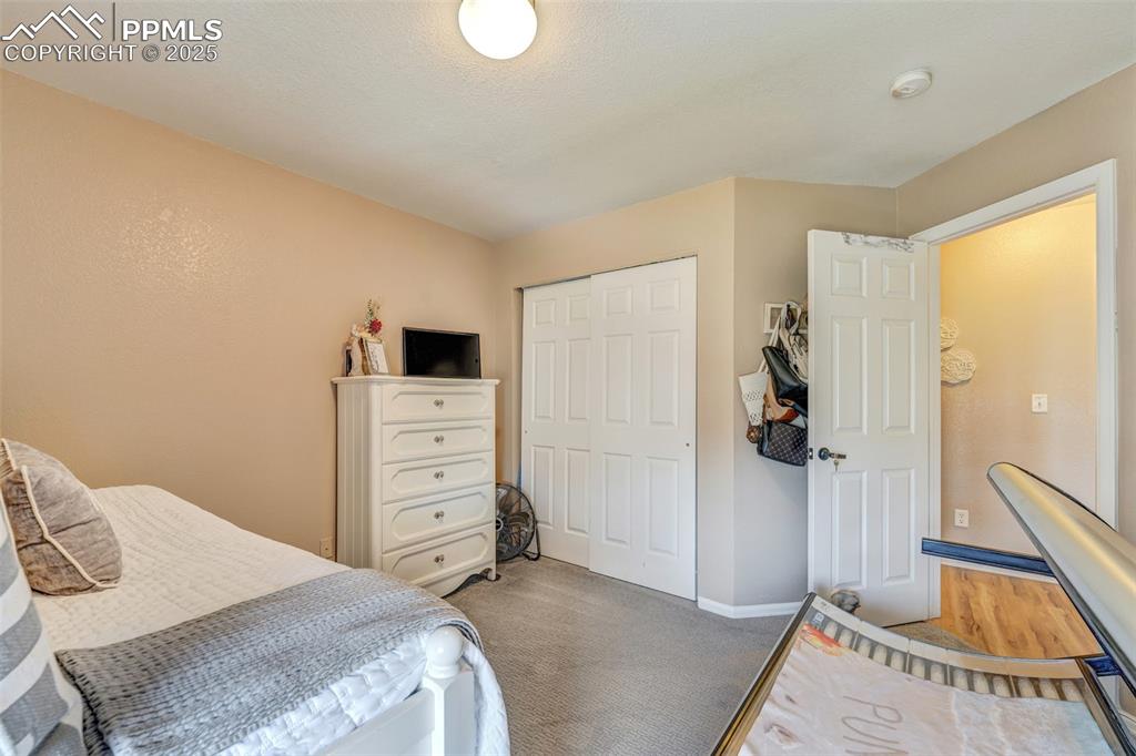 Image 15 of 23: Carpeted bedroom featuring a closet and baseboards