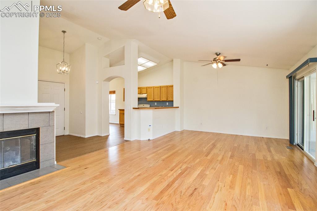 Image 21 of 38: Living room and dining with walkout to sunroom