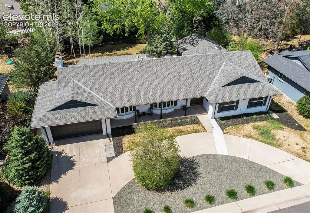 Image 2 of 50: Exterior featuring a gray asphalt shingle roof, white siding, black shutter