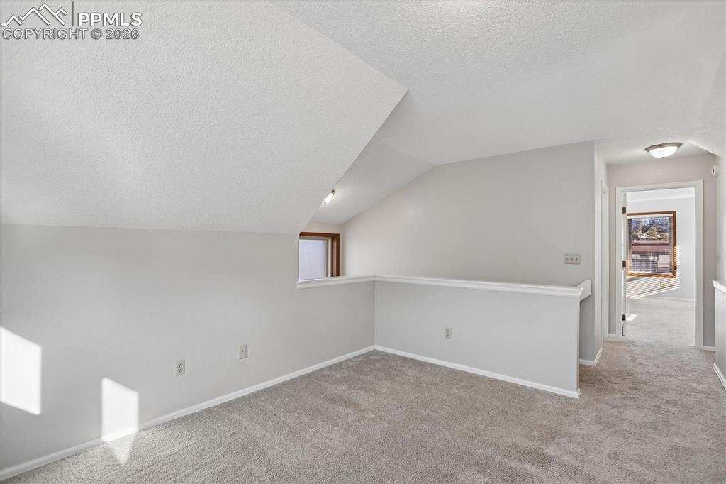 Image 14 of 29: Bonus room featuring carpet floors and healthy amount of natural light