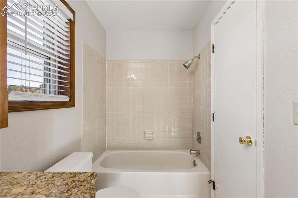 Image 20 of 29: Full bath with vanity and bathing tub / shower combination