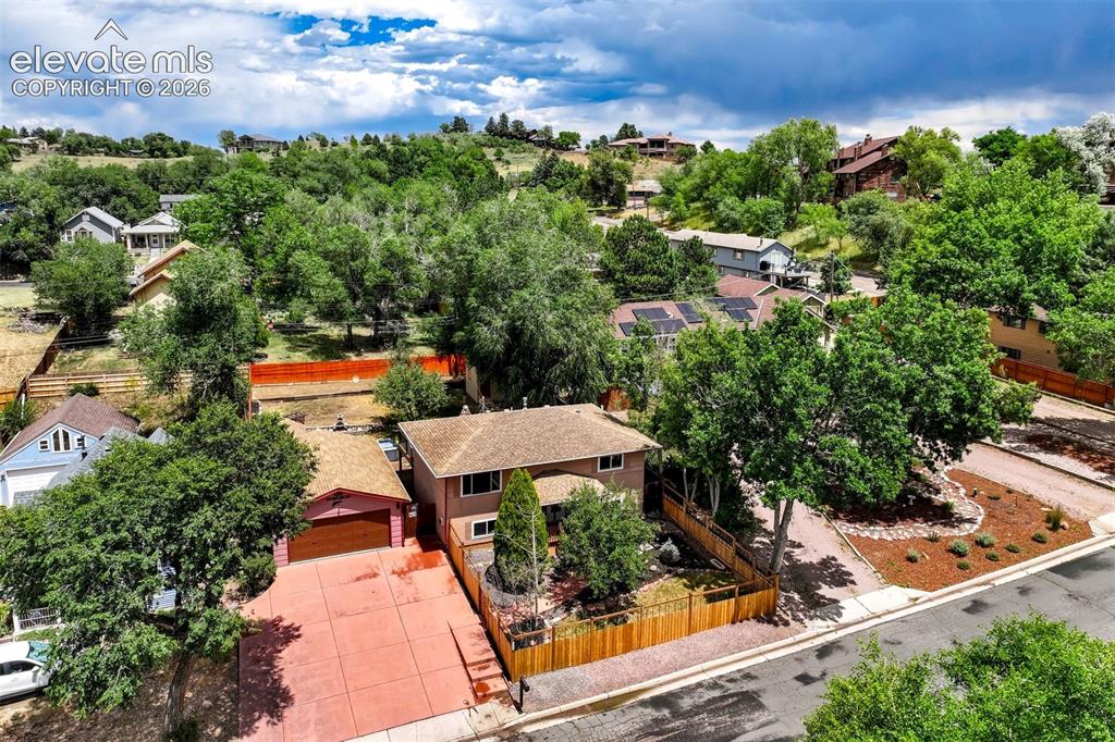 Image 1 of 50: Property featuring a multi-level structure with a gabled roof and a distinc