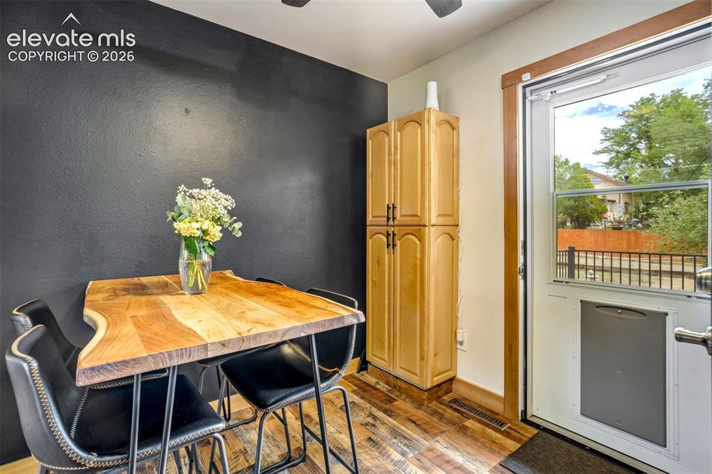 Image 14 of 50: Wood-finish flooring throughout
